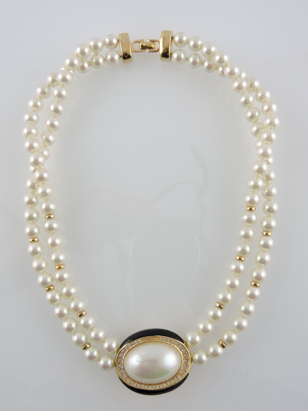 A Christian Dior simulated pearl two strand necklace.