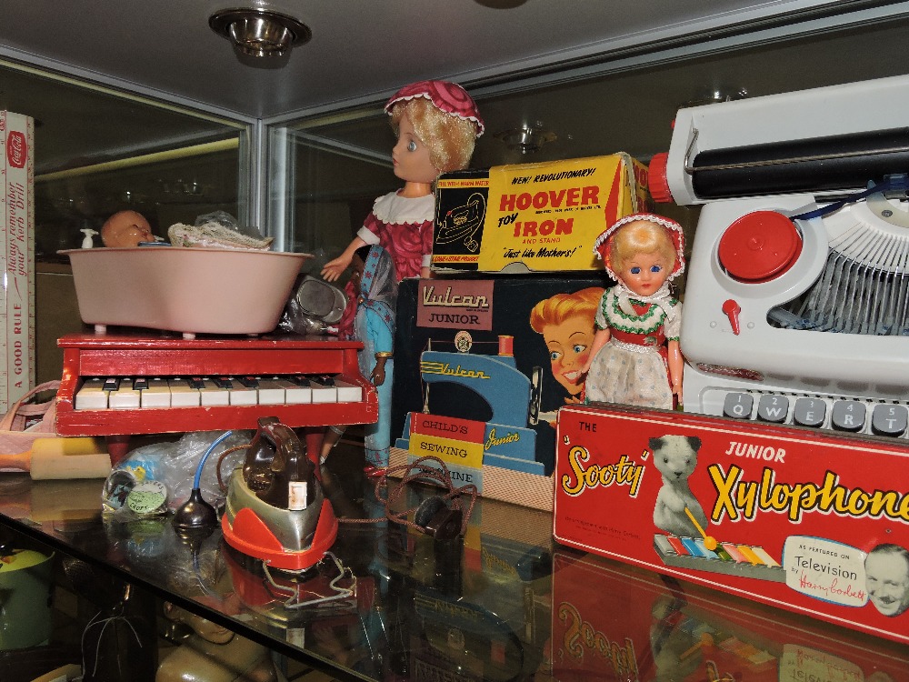 A quantity of assorted mid 20th Century children's toys including a vulcan junior sewing machine,