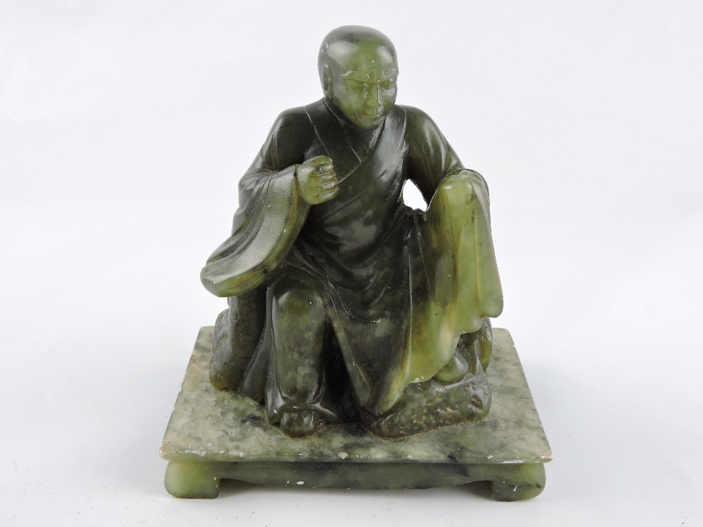 A Chinese carved hardstone figure of a seated robed sage, H. 13cm.