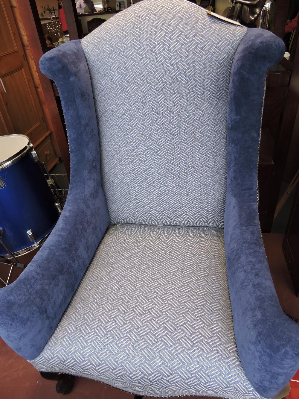 A late Victorian armchair reupholstered in studded blue velvet and patterned fabric with