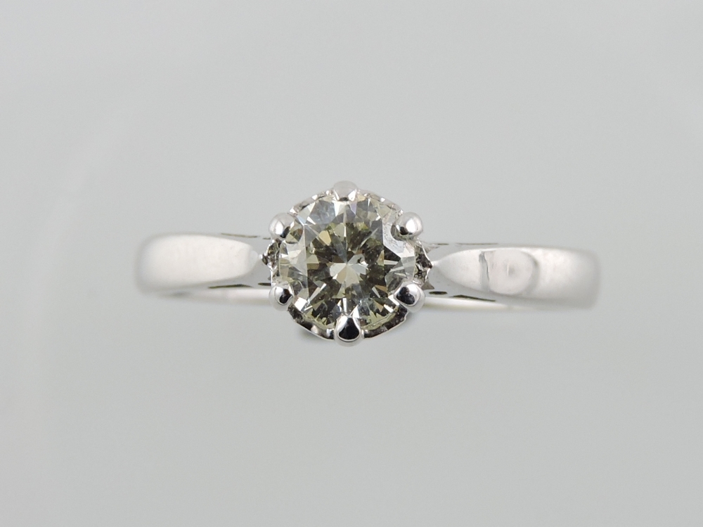 A diamond solitaire ring, the claw set stone approx. 0.5ct in 18ct white gold band.