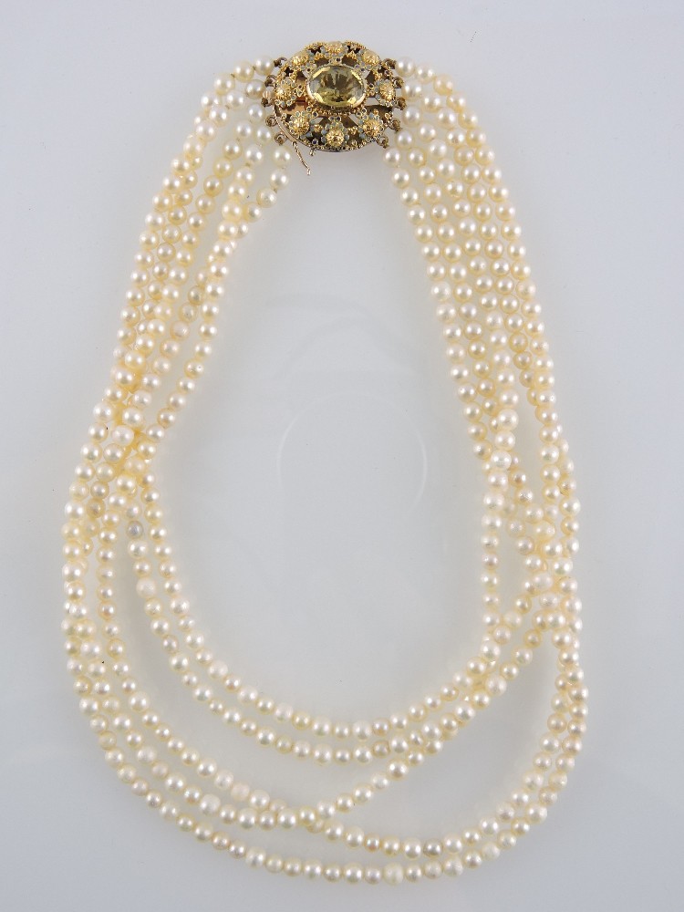 A five strand cultured pearl necklace, the oval enamelled yellow metal clasp set with a central - Image 2 of 3