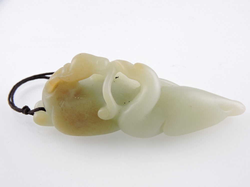 A 19th Century Chinese jade carving on a swan and deer, L. 8cm.