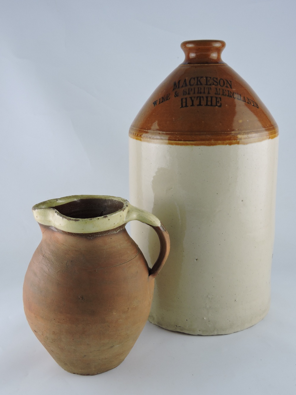 An early 20th Century Mackeson stoneware flagon, marked Hythe, H. 38cm, together with a Victorian