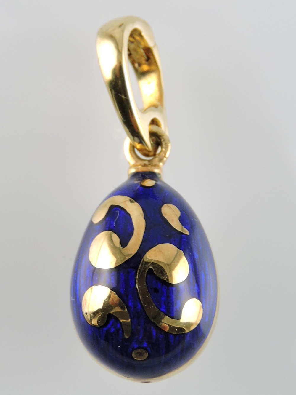 A limited edition 18ct gold Faberge egg pendant in original box with certificate.