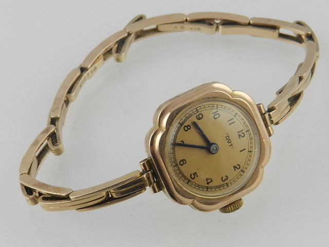 A 9ct yellow gold ladies cocktail watch with sprung articulated bracelet, the quattre foil case