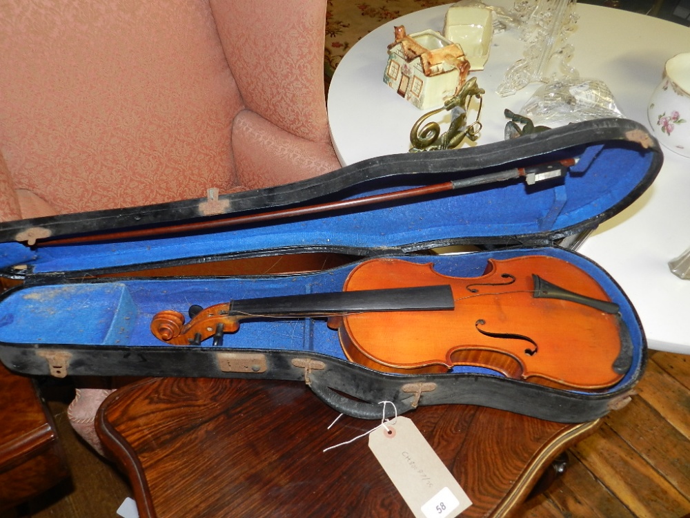 An early 20th century violin, having a 14-inch two piece back, bears Stradivarius label, together