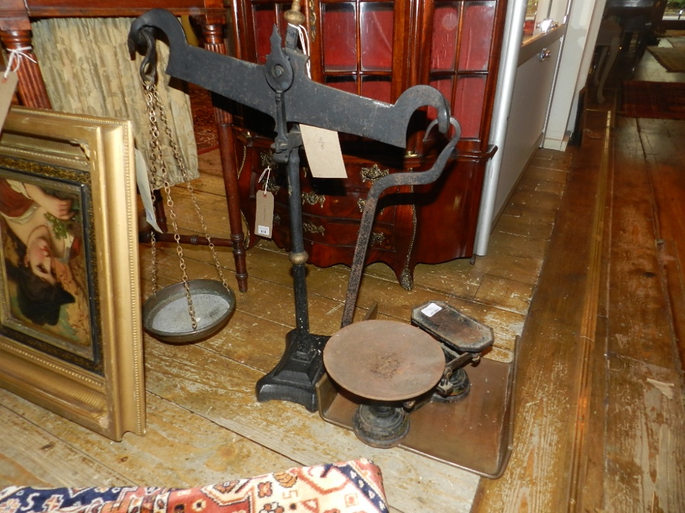 A Victorian cast iron set of balance scales, together with one J.Garland & Co Victorian set of