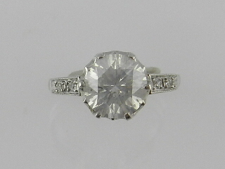 A fine Art Deco style platinum diamond dress ring, centred with a brilliant cut diamond of