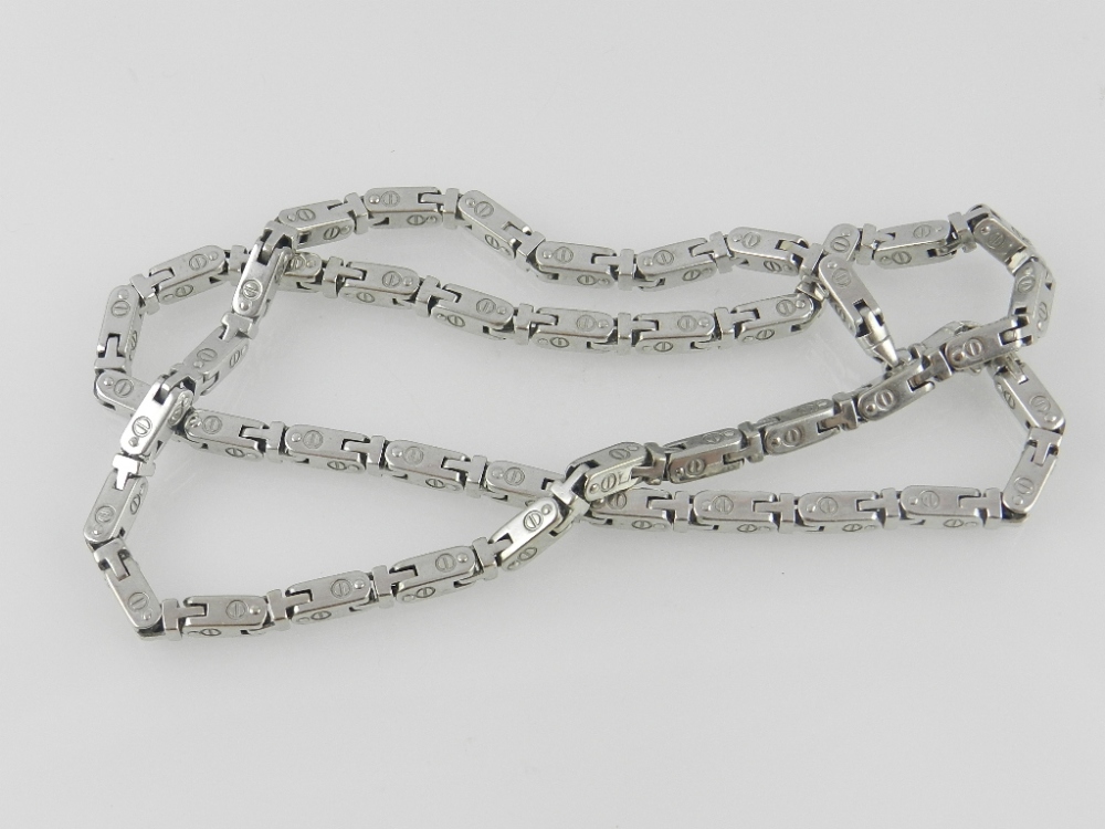 An 9 carat white gold articulated link necklace in the style of Chanel.