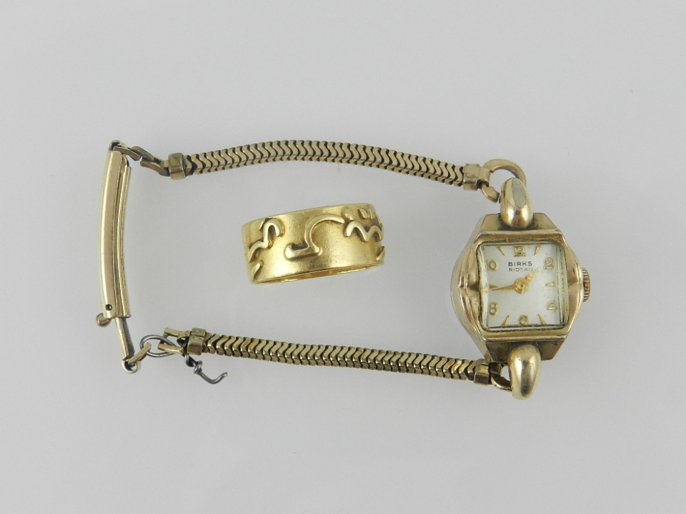 An Art Deco style ladies cocktail watch by Birks Ridau, with silvered Arabic and baton dial, set