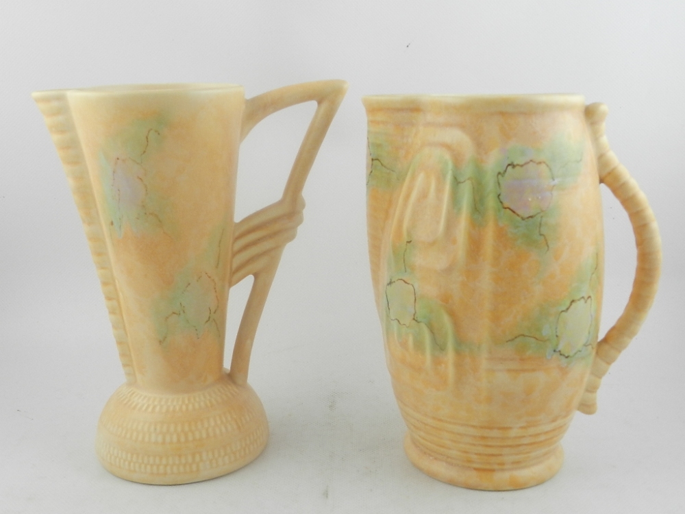 A Beswick pottery jug with geometric moulded design on a pale green peach ground. H.22.5cm. Together