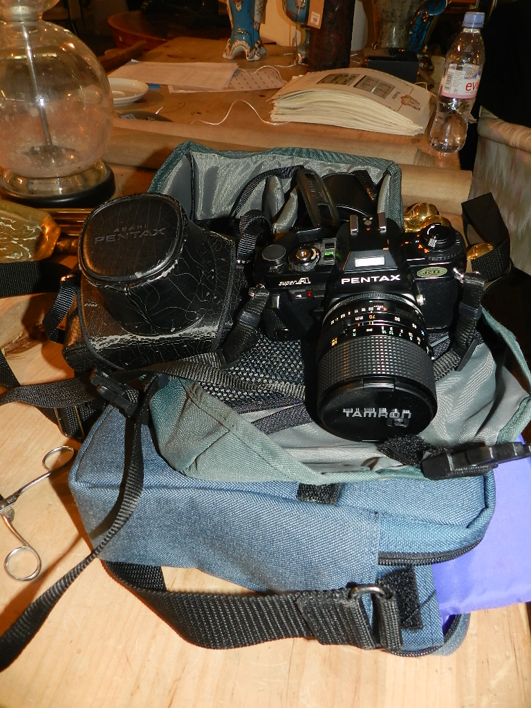 A Pentax 'Super A' SLR camera, together with a Pentax 'Super ME' SLR camera, together with