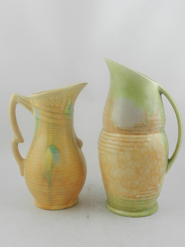 A Beswick Art Deco pottery jug, with geometric reed moulded decoration and a mottled pale green