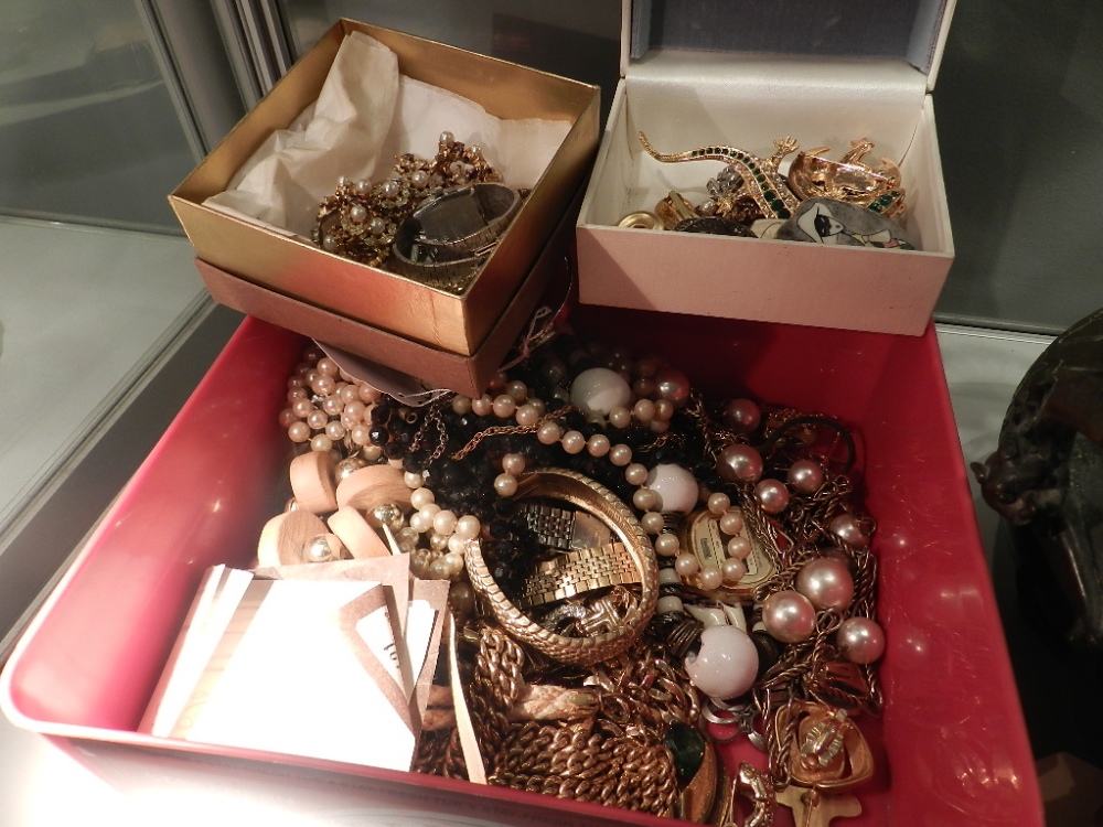 A large collection of costume jewellery including necklaces, brooches, bangles, bracelets, watches