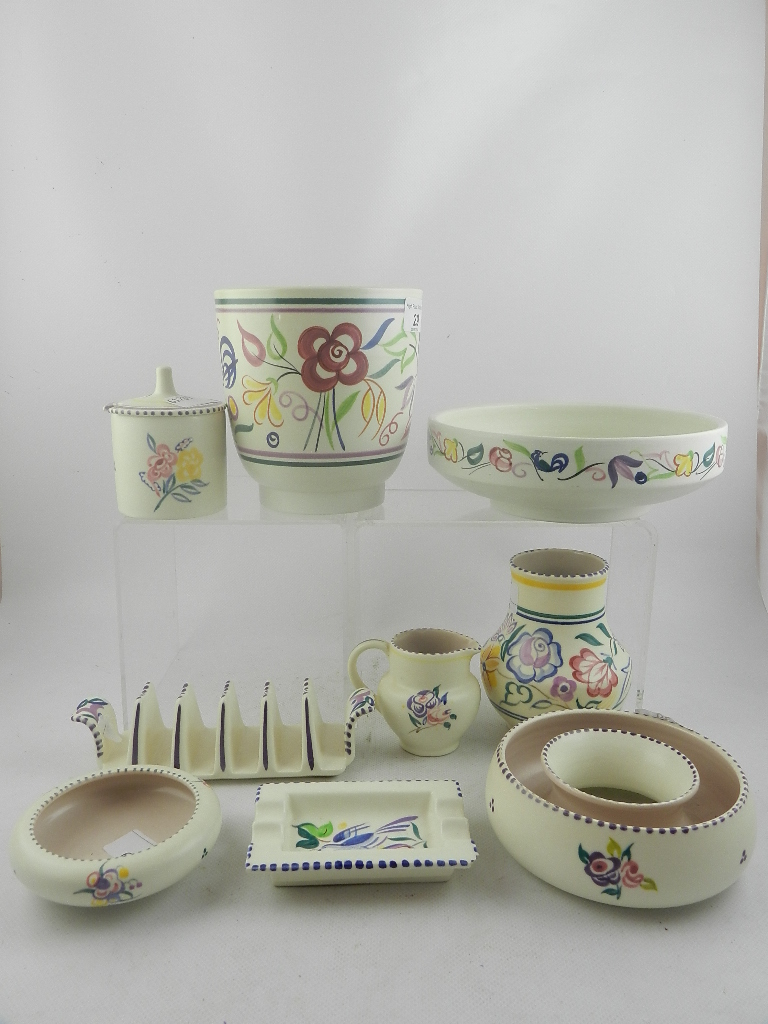 A collection of painted Poole pottery, including vases, a toast rack, jug, preserve jar etc. (9)