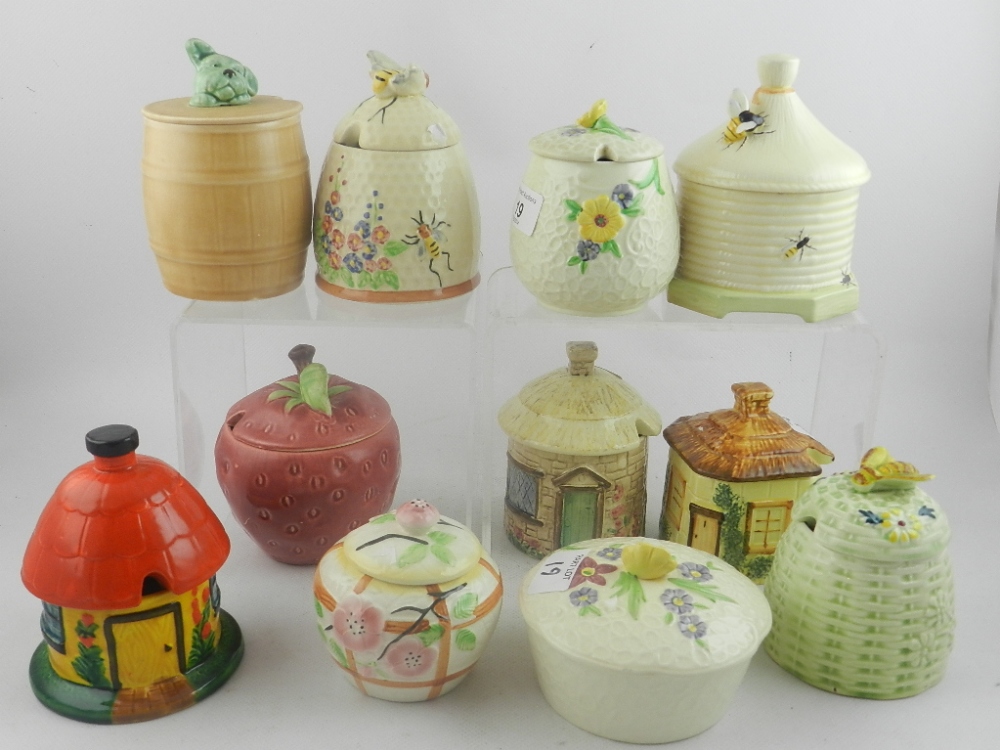 A collection of eleven preserve pots, makers include Shorter, Crown Devon etc, together with a Poole