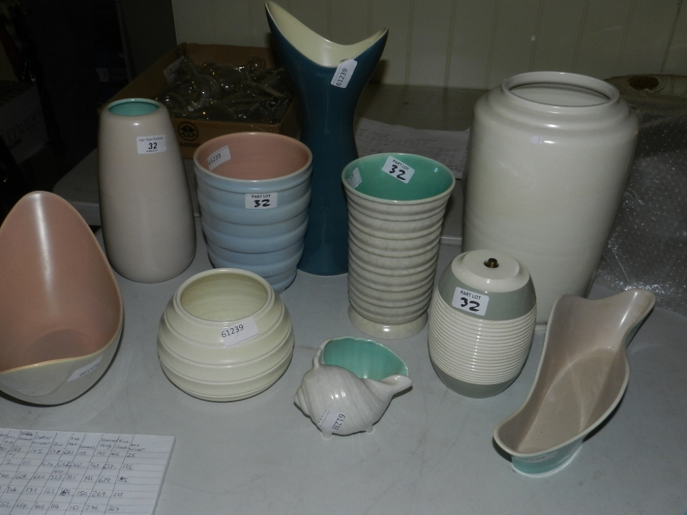 A collection of eight Poole pottery vases of various forms, together with an unusual Poole pottery