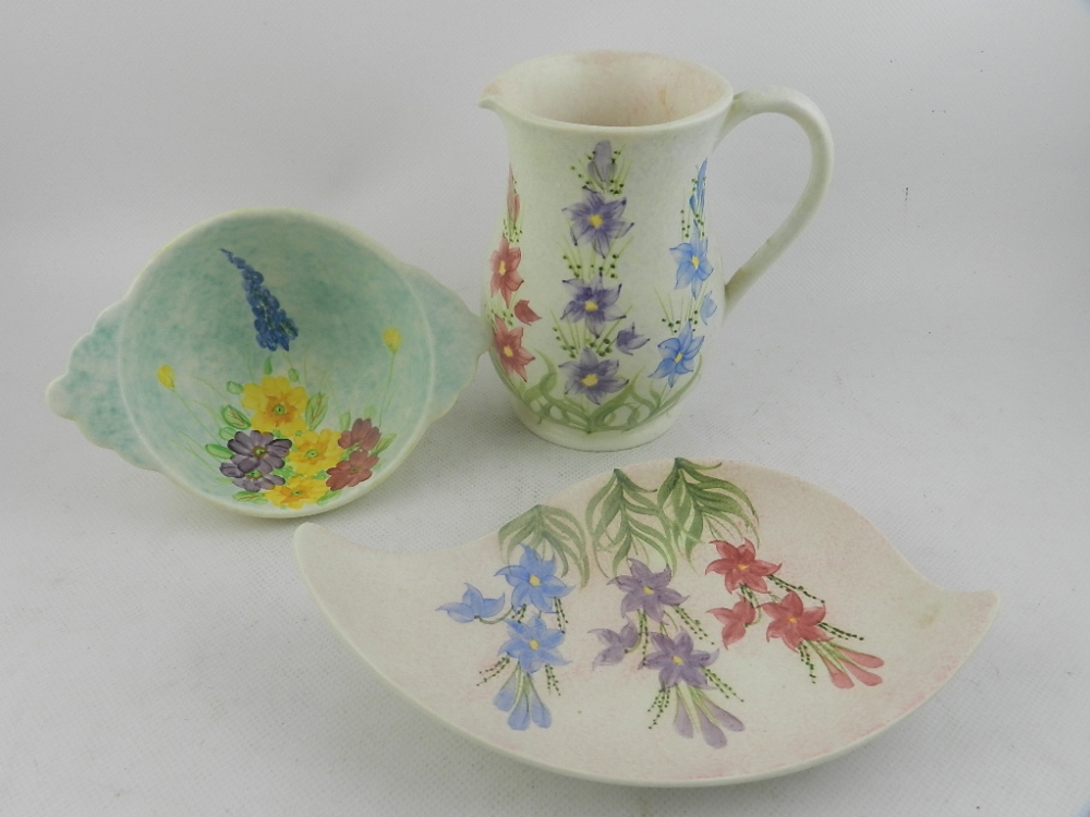 Radford pottery water jug, hand painted with flowers, together with a twin handled bowl and a bow