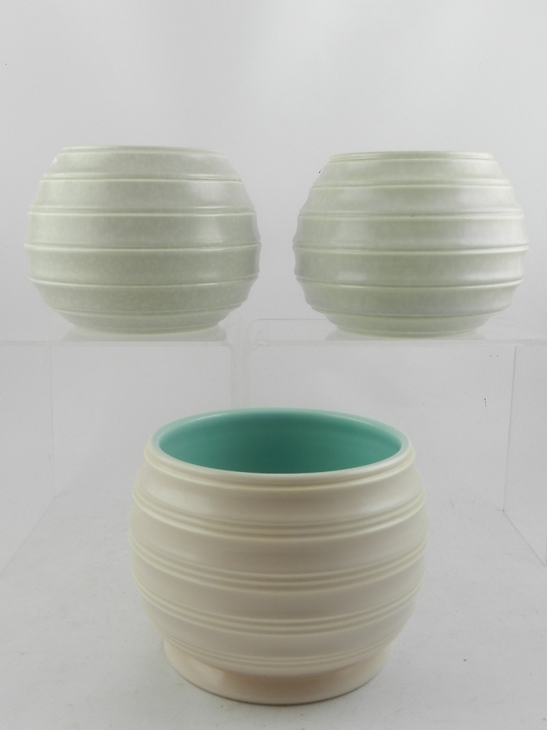 A near matching pair of Poole pottery squat vases, model no. 404, with mottle grey glaze, the