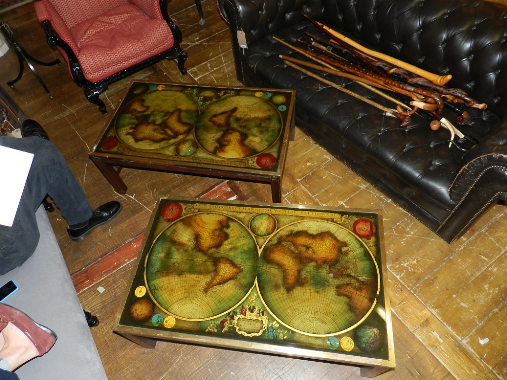 A near pair of unusual mahogany framed low tables, brass bound and line inlaid, the tops decorated