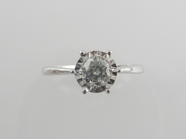 An 18 carat white gold and diamond solitaire ring, the diamond of approx. 0.38 carats, together with