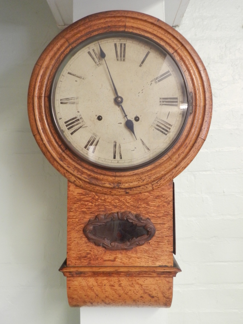 A 19th century oak cased drop dial wall clock, having a Roman painted dial, set eight day two