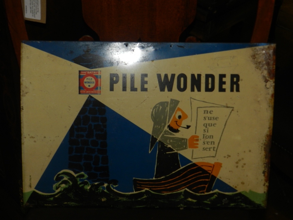 Jean Colin (French, 1912-1982), a tin plated shops display sign for 'Pile Wonder', maritime study of