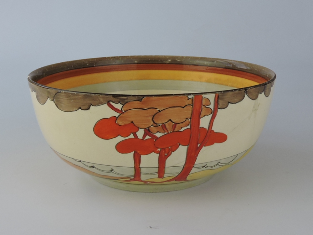 A Clarice Cliff Bizarreware 'Coral Firs' pattern bowl, D. 22cm.