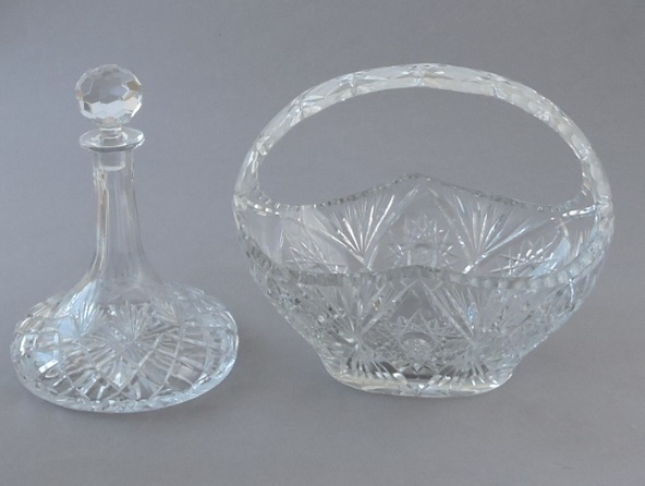 A cut glass lead crystal flower basket, with hoop handle, W. 31cm; together with a cut glass ship'