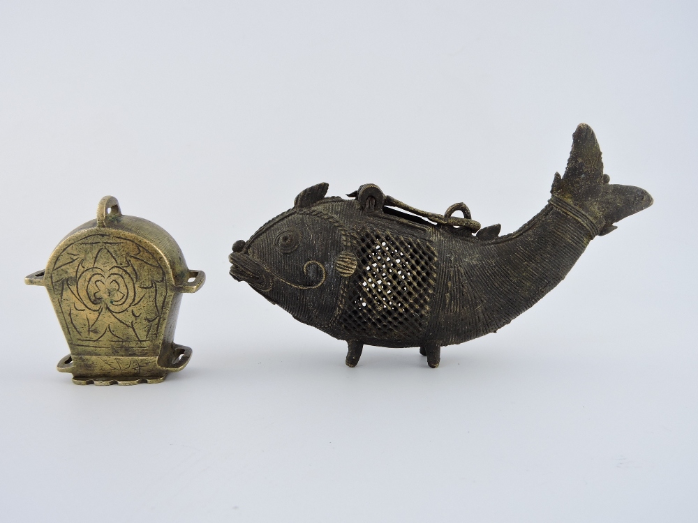 A Chinese bronze vessel cast in the form of a fish, with lattice flanks, W. 16cm; together with a