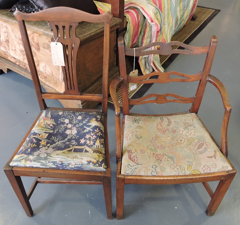 **WITHDRAWN** - An early 19th century mahogany ladder-back elbow chair, the back reduced in size