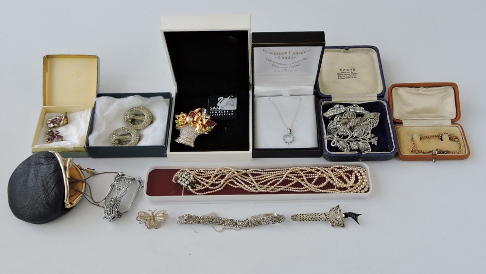 A collection of costume jewellery, including a Swarovski basket cornucopia brooch.