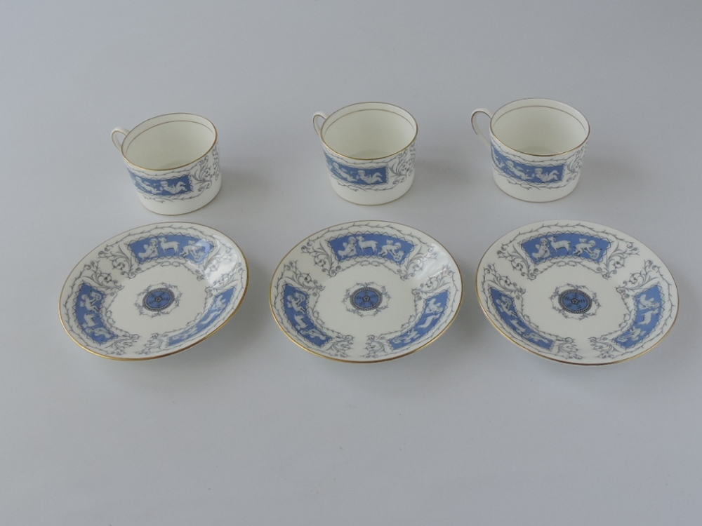 A Coalport Revelry pattern part-coffee service, comprising six coffee cans and saucers, decorated