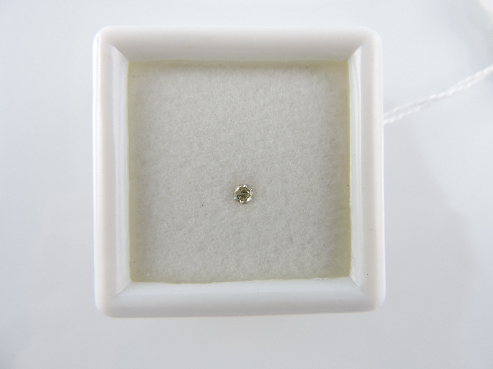 An unmounted brilliant-cut diamond, 0.09ct.