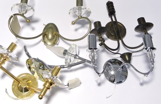 Six assorted metal and glass two- and single branch wall lights.