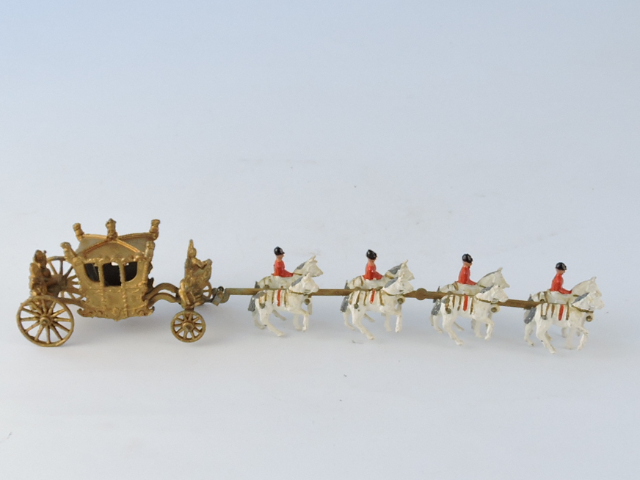 A die-cast model of the State Coach, produced to commemorate the Coronation, the gilt painted