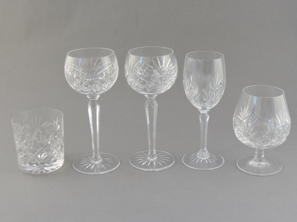 A set of six wine glasses, the bowls on narrow tapering stems; together with a quantity of other