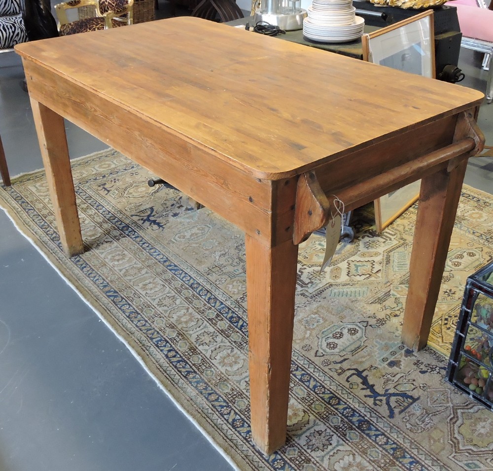 A Victorian style pine kitchen table with rectangular top with hanging rail on square tapered
