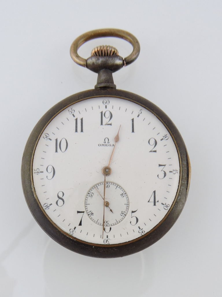 An Omega open faced pocket watch, within gunmetal case, the white enamel dial set out in Arabic