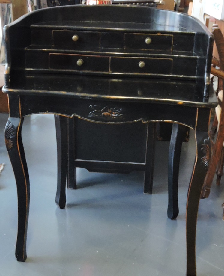 A Victorian style ebonised bonheur de jour, the curved stepped superstructure fitted four drawers on