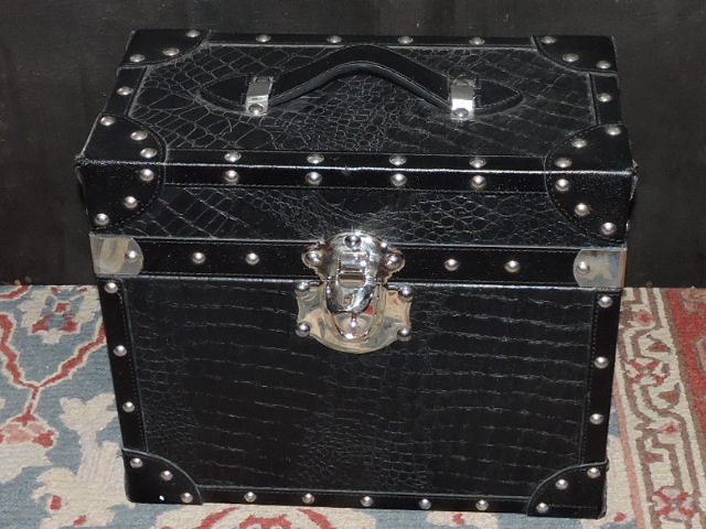 A black faux leather crocodile travelling drinks case, with compartmented bottle and glass tray,