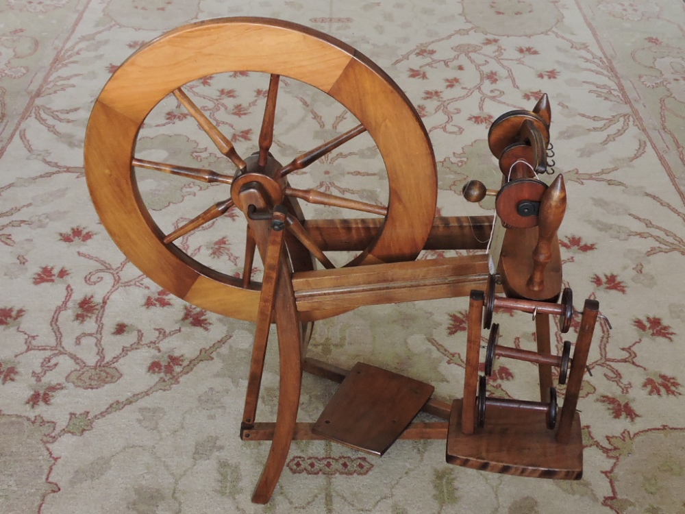 A 1950s Ashford pattern fruitwood spinning wheel, H. 86cm