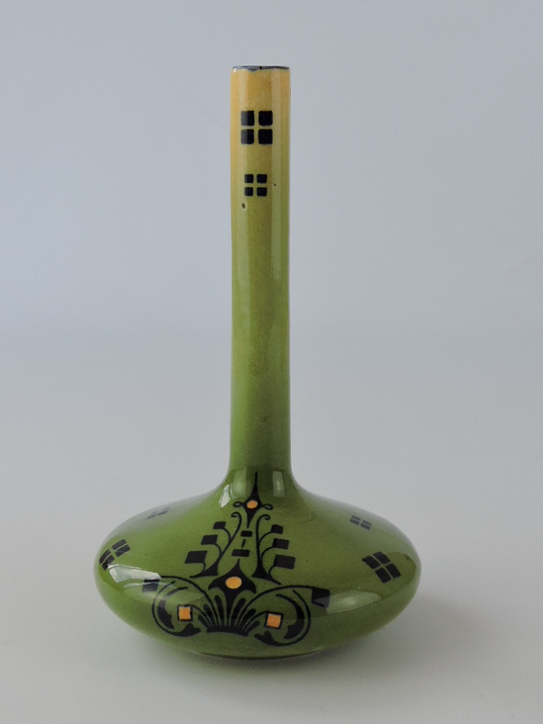 A late 19th century Secessionist style vase, in the manner of Gustav de Bruyn, with long narrow