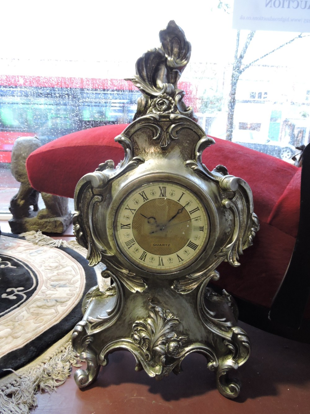 A Louis XVI design silvered bracket timepiece, with Rococo case, H. 70cm.