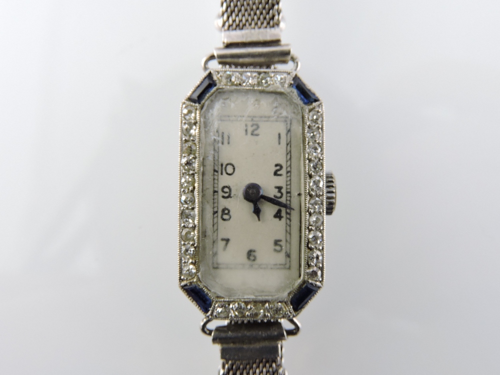 An early 20th century ladies' platinum cocktail watch, the bezel set with sapphires and diamonds