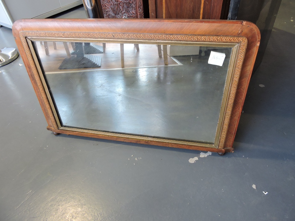 A late Victorian walnut framed overmantel mirror, rectangular Tunbridgeware banding and gilt slip