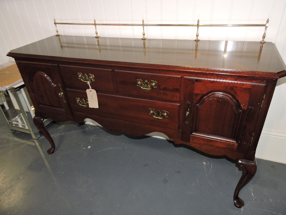 A Queen Anne style cherrywood sideboard, with three-quarter brass gallery over three central drawers