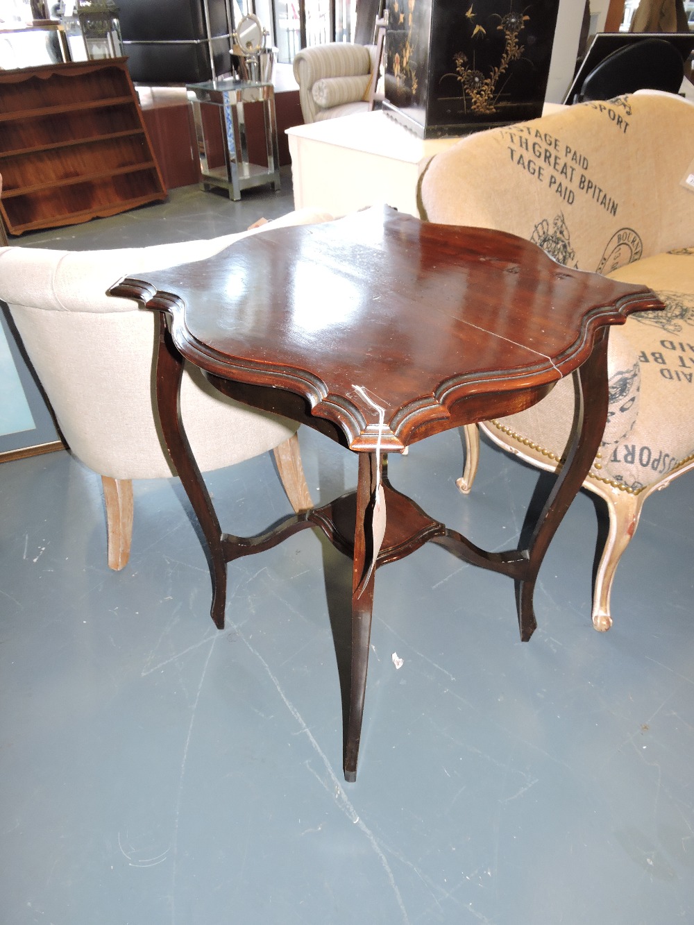 A late Victorian mahogany occasional table, on angular cabriole legs with undertier, W. 58cm.