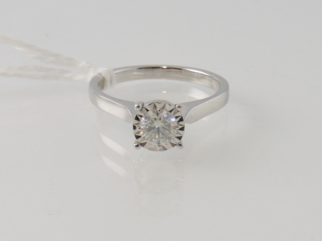 A diamond solitaire ring, approx. 0.35ct, the illusion claw setting on an 18ct white gold band, 3.